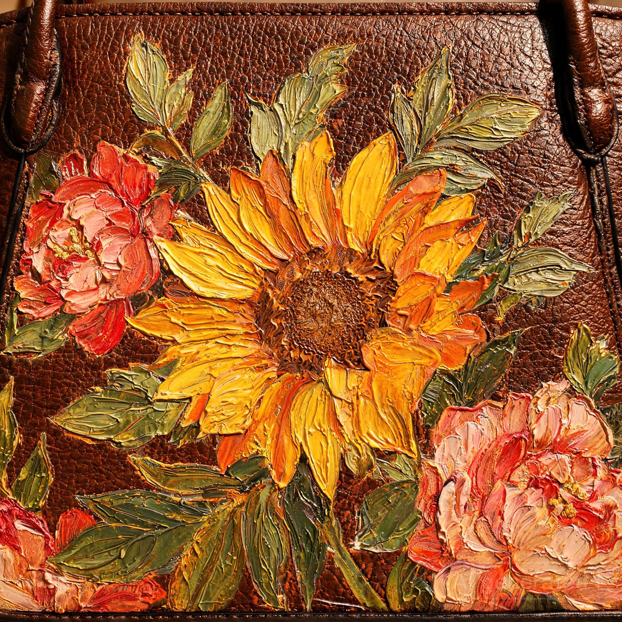 Close-up of oil painting texture on a guochao-inspired PU leather handbag surface with floral motifs in warm artistic tones.