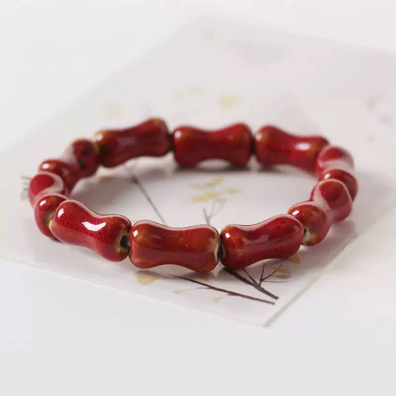 Red bamboo-shaped ceramic bracelet handcrafted jewelry.jpg
