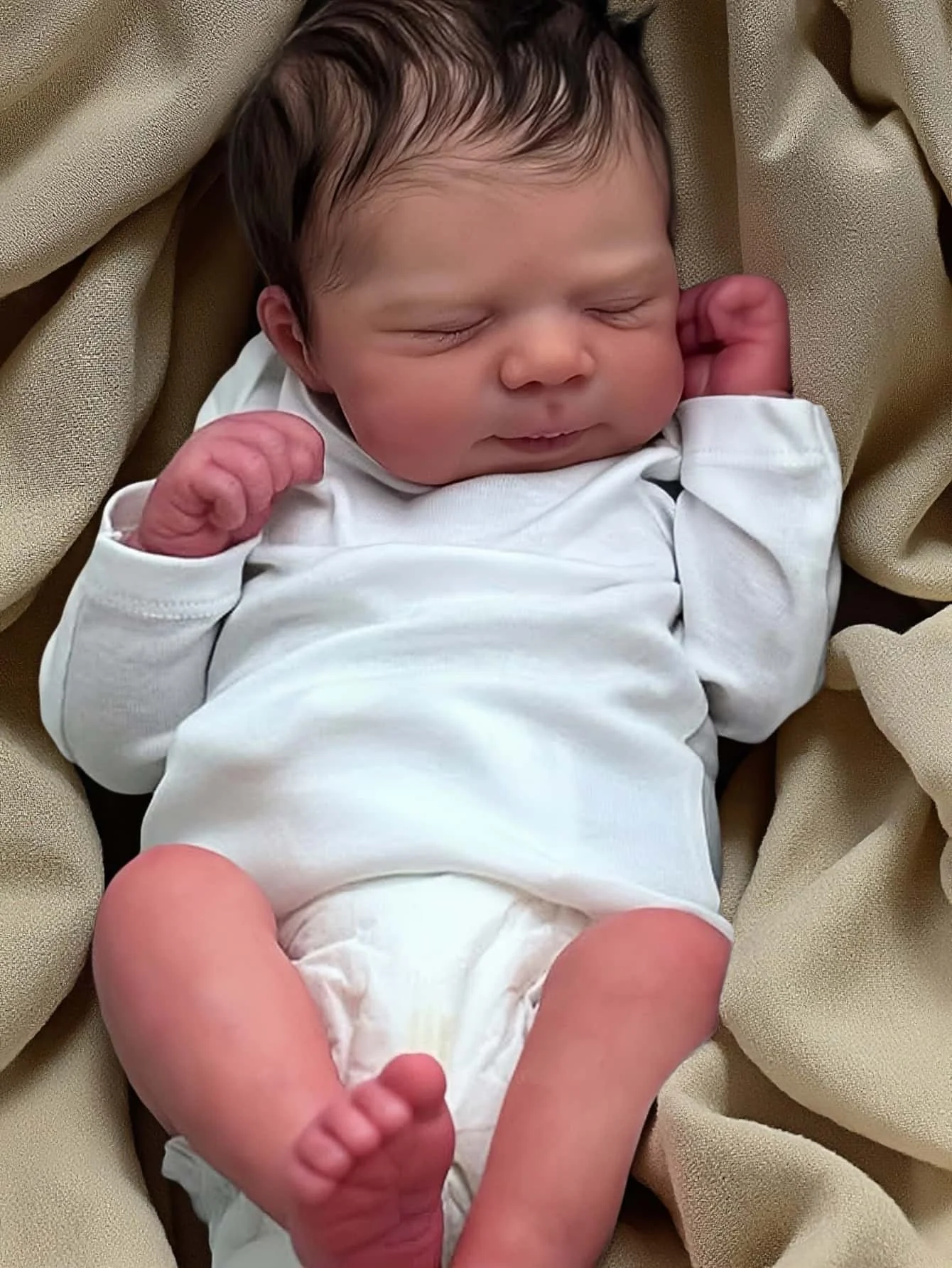 Full view of the lifelike reborn doll